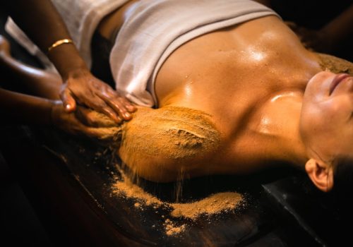 Ayurvedic herbal body therapy during a Panchakarma treatment, illustrating Panchakarma and oxidative stress research