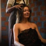 Woman receiving traditional Ayurvedic head massage at Kairali Ayurvedic Health Village Kerala