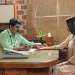 Ayurvedic doctor checking a patient's pulse during a traditional consultation at Kairali Ayurvedic Healing Village in Palakkad, Kerala.