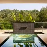 Heated saltwater pool surrounded by tropical greenery at villa raag, goa