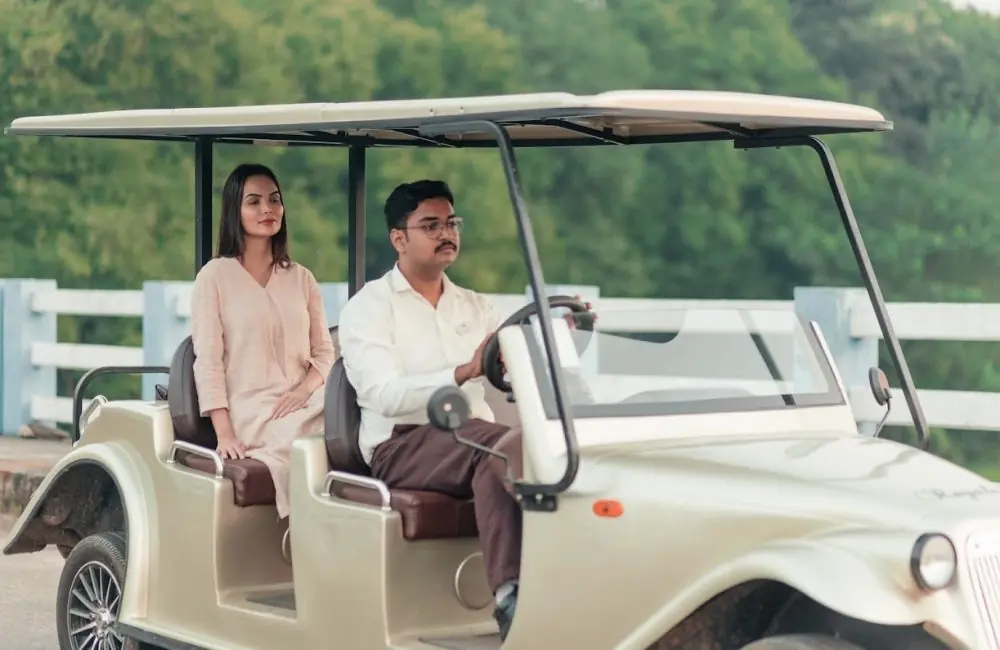 Eco-friendly buggy escort for a solo female guest at Kairali – The Ayurvedic Healing Village, Kerala, India.