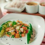 Colorful Ayurvedic salad at Kairali – The Ayurvedic Healing Village, Kerala: cucumber slices with diced seasonal fruits and vegetables sprinkled with black sesame.
