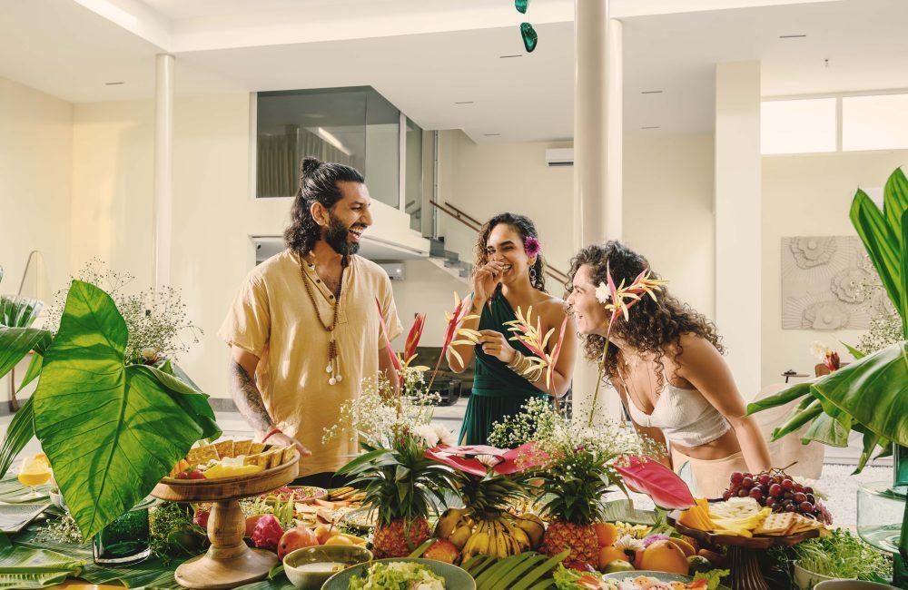 Guests enjoying a relaxed, tropical brunch experience at Villa Raag in Agonda, South Goa, surrounded by fresh fruit, greenery, and warm natural light