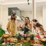 Guests enjoying a relaxed, tropical brunch experience at Villa Raag in Agonda, South Goa, surrounded by fresh fruit, greenery, and warm natural light