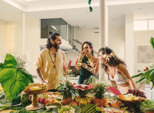 Guests enjoying a relaxed, tropical brunch experience at Villa Raag in Agonda, South Goa, surrounded by fresh fruit, greenery, and warm natural light
