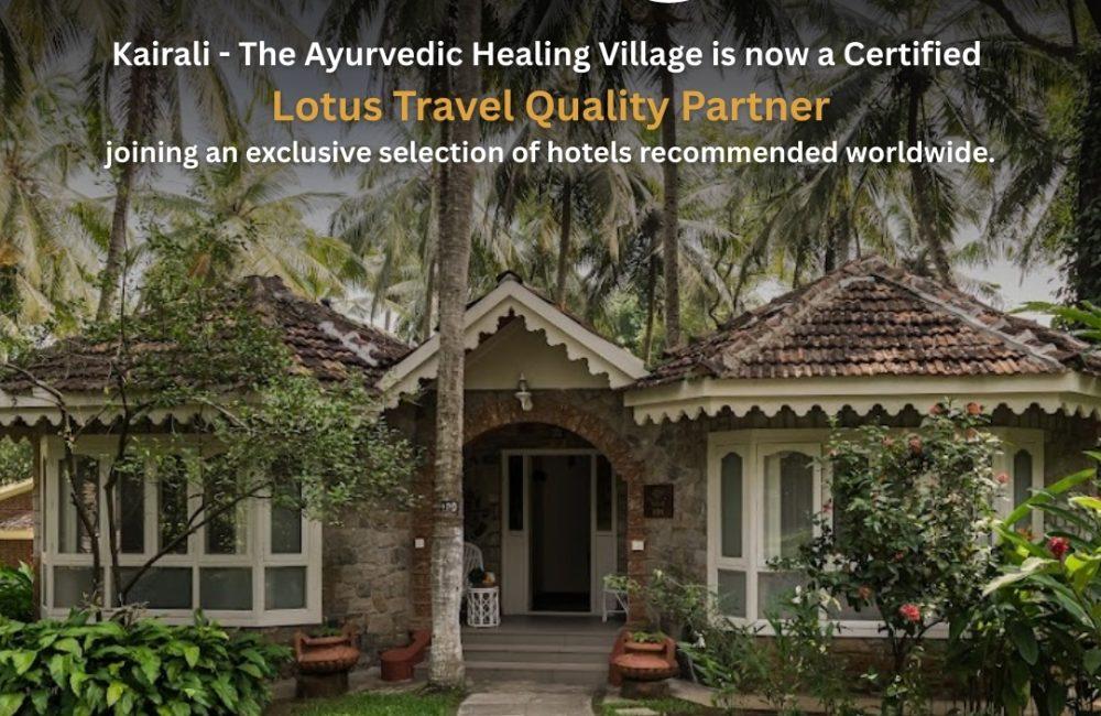 Front view of a heritage villa at Kairali – The Ayurvedic Healing Village in Kerala, surrounded by coconut palms and gardens, with text announcing its certification as a Lotus Travel Quality Partner 2026.