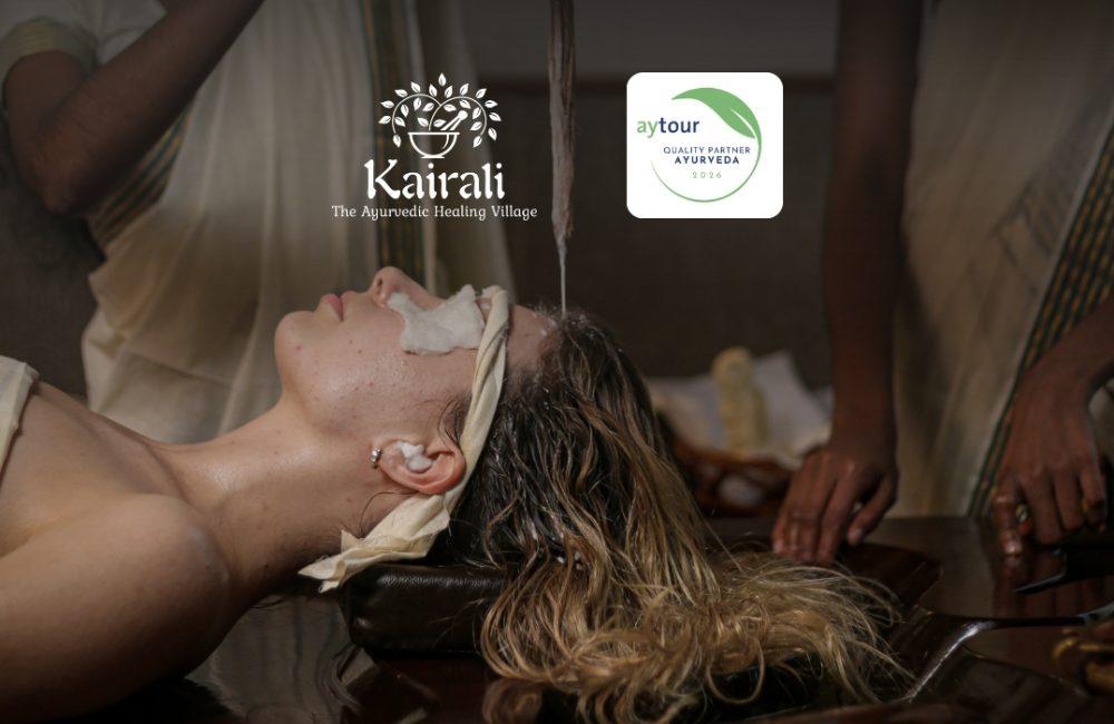 Shirodhara therapy being performed at Kairali – The Ayurvedic Healing Village, with an overlay noting “Aytour Quality Partner – Ayurveda 2026.