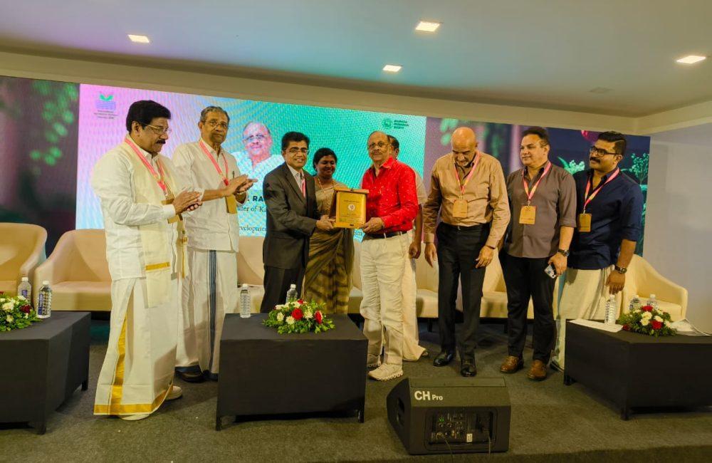 Award presentation on stage at the International Ayurveda & Wellness Conclave 2026, honoring excellence in wellness and Ayurveda tourism.