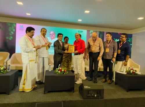 Award presentation on stage at the International Ayurveda & Wellness Conclave 2026, honoring excellence in wellness and Ayurveda tourism.