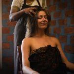Woman receiving an Ayurvedic head massage at Kairali’s healing village in Kerala