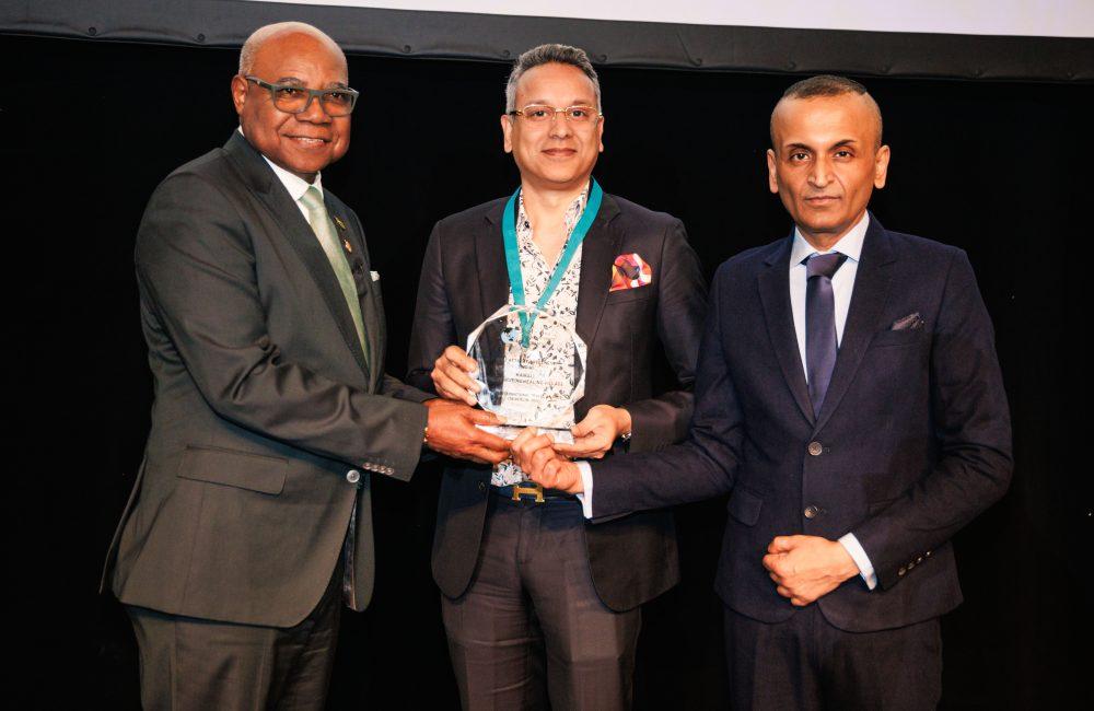 Representatives of Kairali - The Ayurvedic Healing Village receiving the PATWA Award for Best Retreat Wellness (India) at ITB Berlin 2026, presented by H.E. Edmund Bartlett, Minister of Tourism, Jamaica.