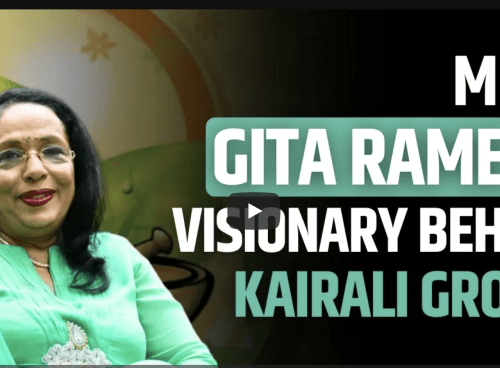 Thumbnail featuring Gita Ramesh in a green outfit with the text “Meet Gita Ramesh, Visionary Behind Kairali Group” and DNA branding.