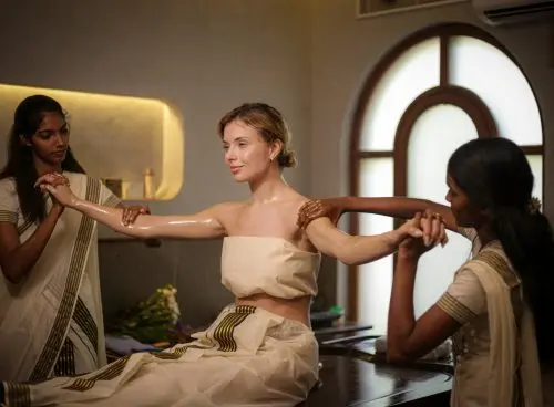 Ayurvedic Abhyanga therapy at Kairali Ayurvedic Healing Village Palakkad showing synchronized oil massage for holistic wellness