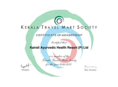 Elegant woman in traditional saree representing Kerala’s cultural hospitality and wellness tourism experience