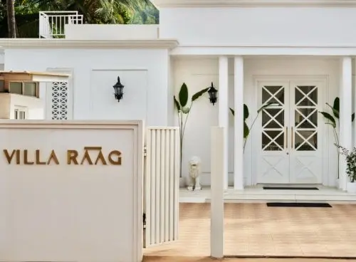 Entrance of Villa Raag, a luxury wellness villa in South Goa with elegant white architecture and tropical surroundings