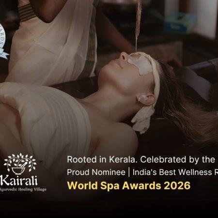 A therapist performs Shirodhara, an Ayurvedic treatment, pouring a stream of warm oil onto the forehead of a woman lying peacefully on a treatment table, with eye pads and ear coverings in place.