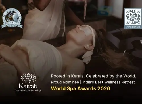 A therapist performs Shirodhara, an Ayurvedic treatment, pouring a stream of warm oil onto the forehead of a woman lying peacefully on a treatment table, with eye pads and ear coverings in place.