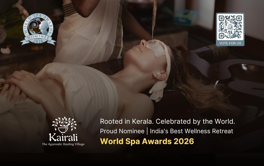 A therapist performs Shirodhara, an Ayurvedic treatment, pouring a stream of warm oil onto the forehead of a woman lying peacefully on a treatment table, with eye pads and ear coverings in place.