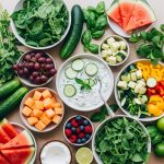Ayurvedic summer diet for gut health spread with tzatziki, cucumber, watermelon, fresh greens and berries