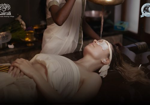 Guest receiving a traditional Ayurvedic therapy at Kairali – The Ayurvedic Healing Village, a World Spa Awards 2026 nominee, in a serene treatment setting in Kerala.