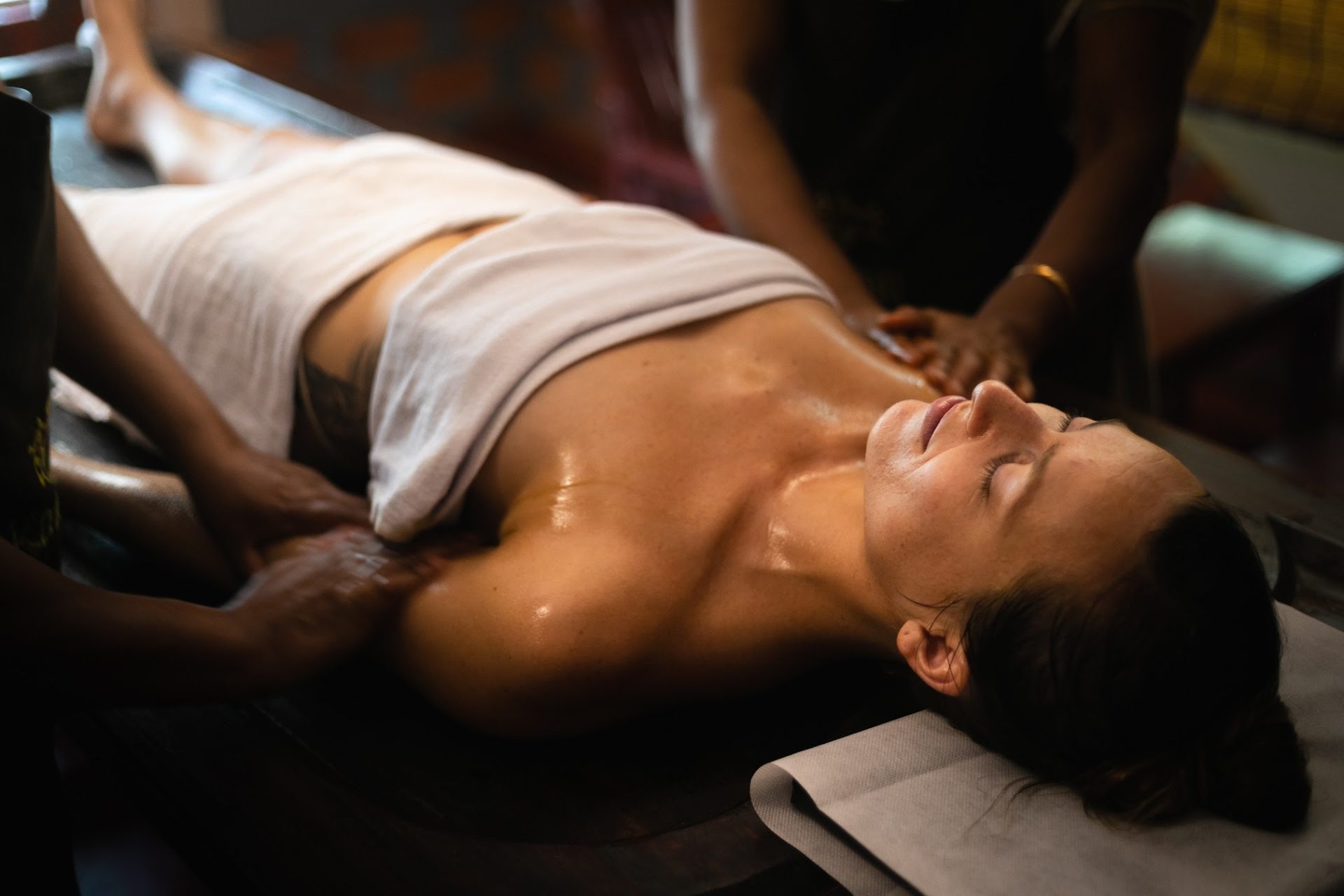 Karkidaka Masam Ayurveda oil massage therapy at traditional Kerala wellness center