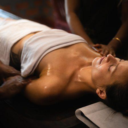 Karkidaka Masam Ayurveda oil massage therapy at traditional Kerala wellness center