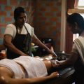 Ayurvedic oil therapy being performed by two therapists at Kairali – The Ayurvedic Healing Village in Kerala.