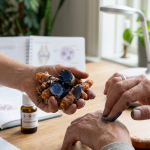 Blue turmeric for joint health shown during a discussion about joint care, with fresh Curcuma caesia rhizomes beside an older adult.