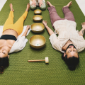 Guests relaxing during a sound healing session at Villa Raag Goa wellness hotel