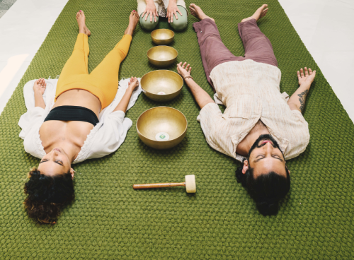 Guests relaxing during a sound healing session at Villa Raag Goa wellness hotel