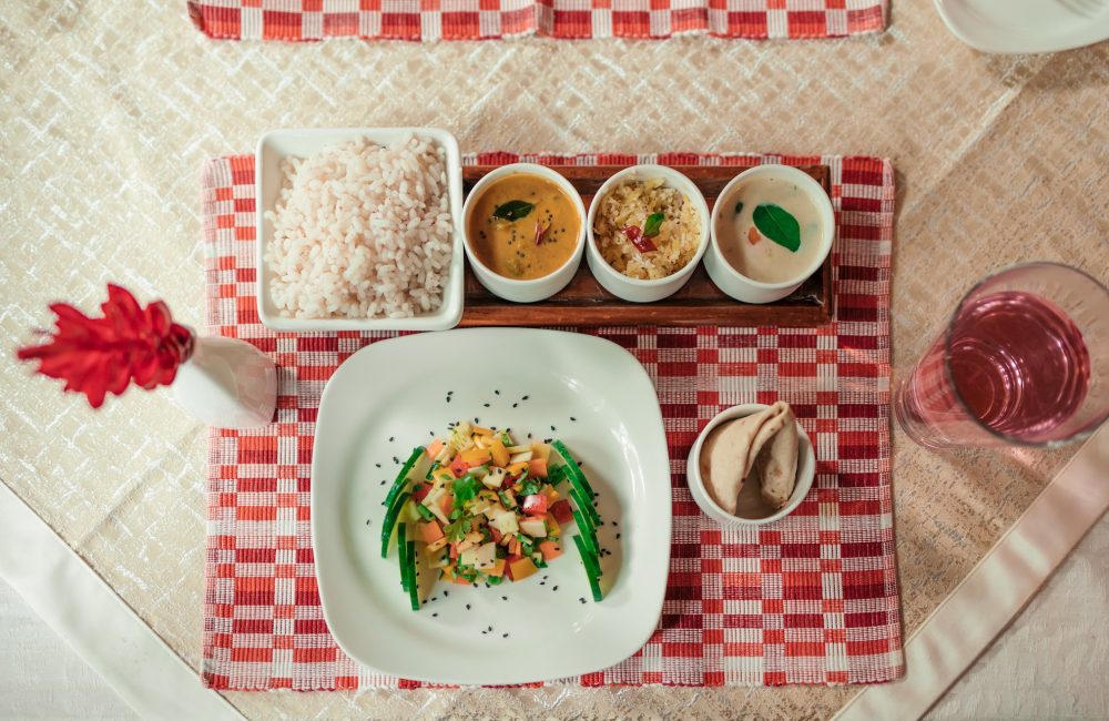 Eating according to prakriti with an Ayurvedic meal of rice, vegetables, curries and accompaniments served at Kairali in Kerala.