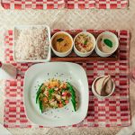 Eating according to prakriti with an Ayurvedic meal of rice, vegetables, curries and accompaniments served at Kairali in Kerala.