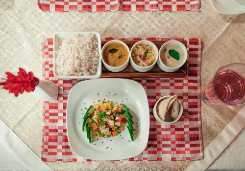 Eating according to prakriti with an Ayurvedic meal of rice, vegetables, curries and accompaniments served at Kairali in Kerala.