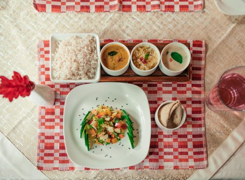 Eating according to prakriti with an Ayurvedic meal of rice, vegetables, curries and accompaniments served at Kairali in Kerala.