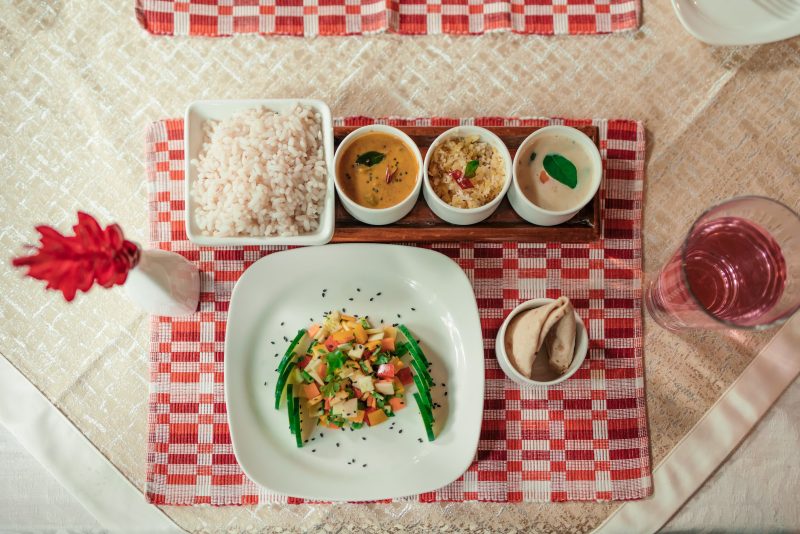 Eating according to prakriti with an Ayurvedic meal of rice, vegetables, curries and accompaniments served at Kairali in Kerala.