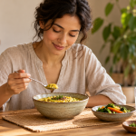 Breaking a fast according to Ayurveda with a woman enjoying a light, nourishing meal of rice, lentils and cooked vegetables.
